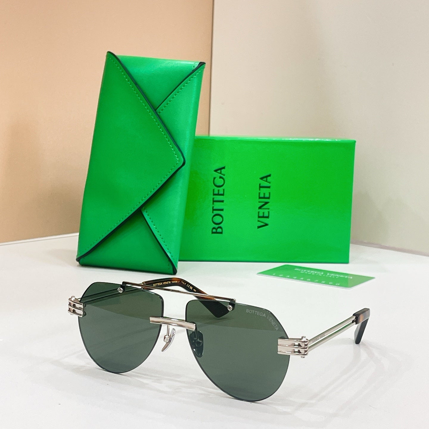 Gold metal sunglasses with dark lenses and slim rectangular frames
