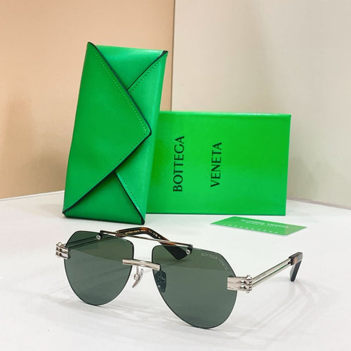 Gold metal sunglasses with dark lenses and slim rectangular frames