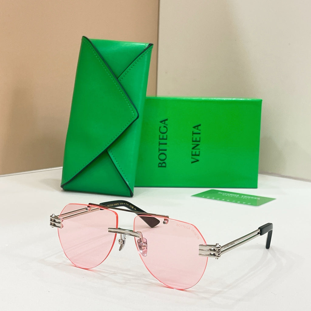 Rose gold sunglasses with pink lenses and slim rectangular frames