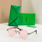 Rose gold sunglasses with pink lenses and slim rectangular frames