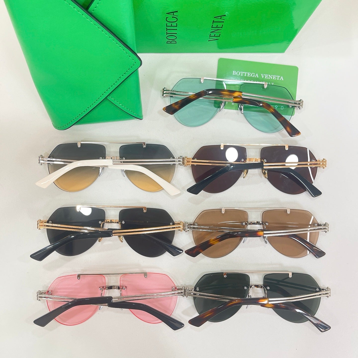 Multi-pack of sunglasses with various lens tints and slim metal frames, laid out