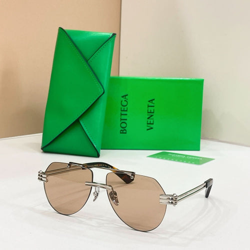 Gold metal sunglasses with tan-tinted lenses and slim rectangular frames