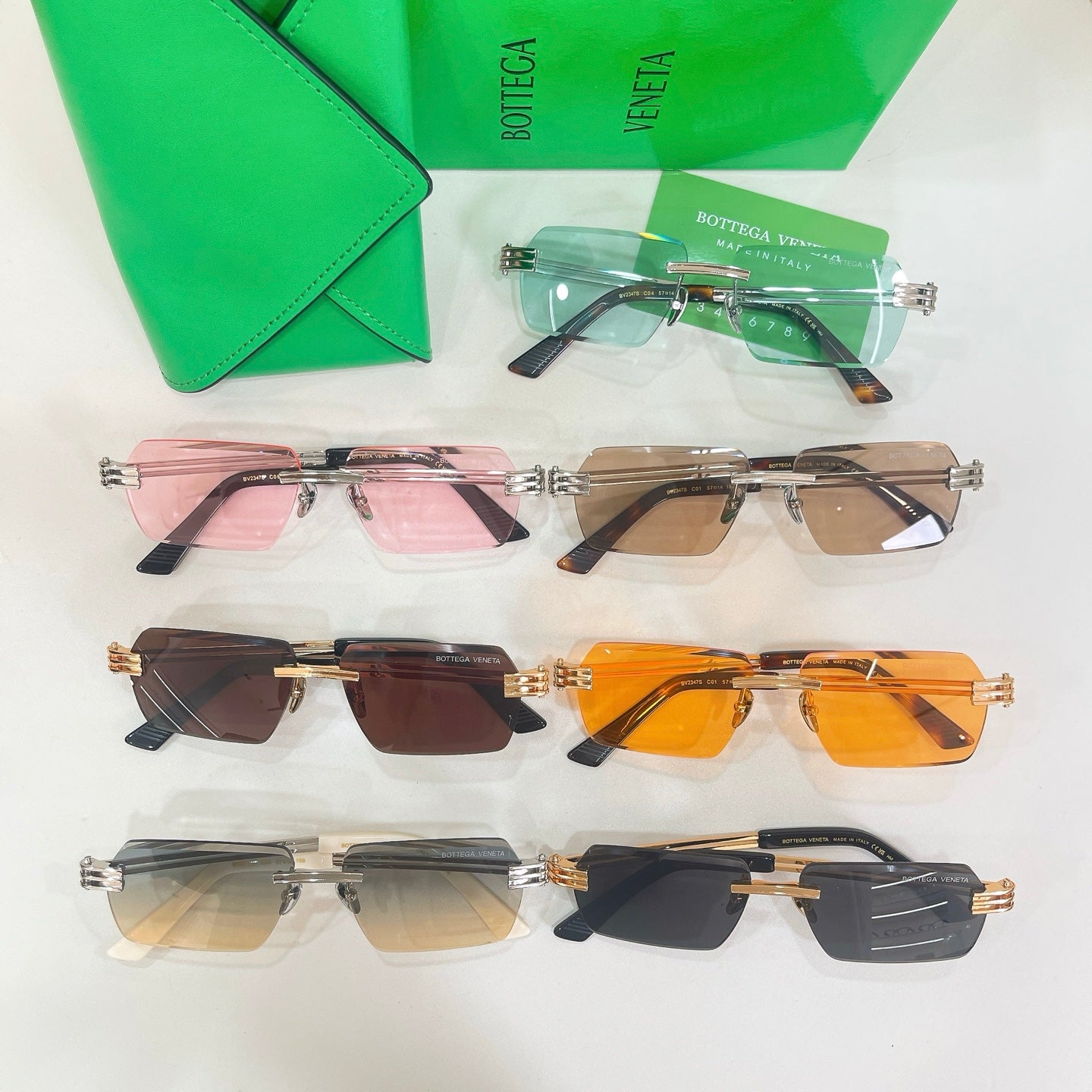Bottega Veneta sunglasses assortment with multiple lens colors and matching gold-tone metal frames