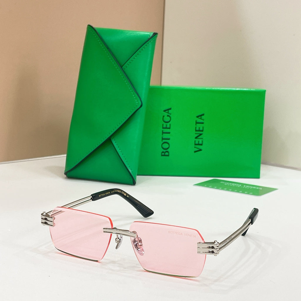 Bottega Veneta sunglasses with pink lenses, silver-tone frames, and rose-pink temples