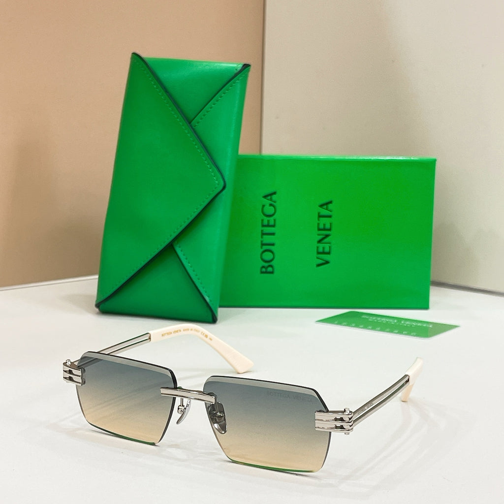 Bottega Veneta sunglasses with light blue lenses, silver-tone frames, and tortoise-detail temples