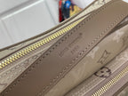 Beige monogram bag with zipper track and brown leather edge trim, gold zipper pull.