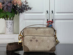 Beige monogram crossbody bag with top handle and shoulder strap, gold-tone hardware.