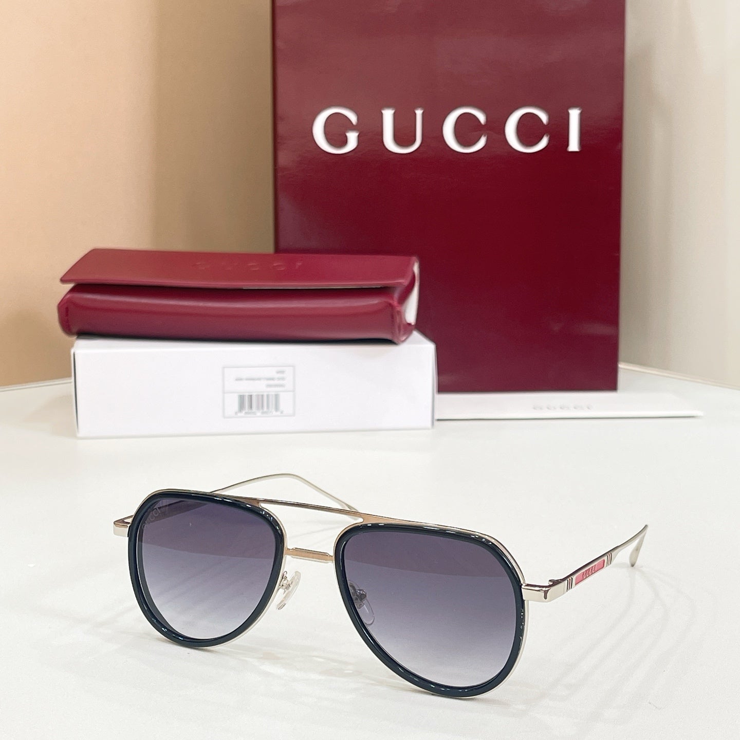 Gucci sunglasses with black frame, white bridge detail, and purple-tinted lenses