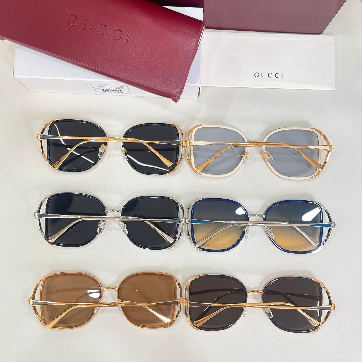 Gucci sunglasses set of three rows: black, blue, and tan framed pairs