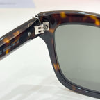 YSL sunglasses temple and hinge detail, tortoise frame with dark lenses