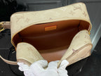 Louis Vuitton bag open top view, beige monogram exterior with brown interior