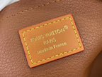 Louis Vuitton bag leather patch with neon yellow stitching, “Made in France” text