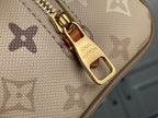 Louis Vuitton zipper pull with gold hardware on beige monogram canvas