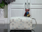 Cream monogram crossbody bag with blue pattern and top carry handle