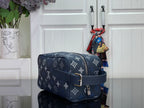 Louis Vuitton bag in dark navy with monogram, flap, crossbody strap, and silver buckle
