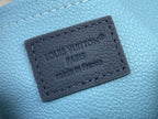 Louis Vuitton bag close-up of navy leather label reading Louis Vuitton Paris and Made in France