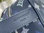 Louis Vuitton bag close-up of embossed logo on navy textured leather trim