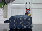Louis Vuitton bag in dark navy with monogram pattern and zip closure