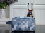 Blue check toiletry bag with top zipper and short handle