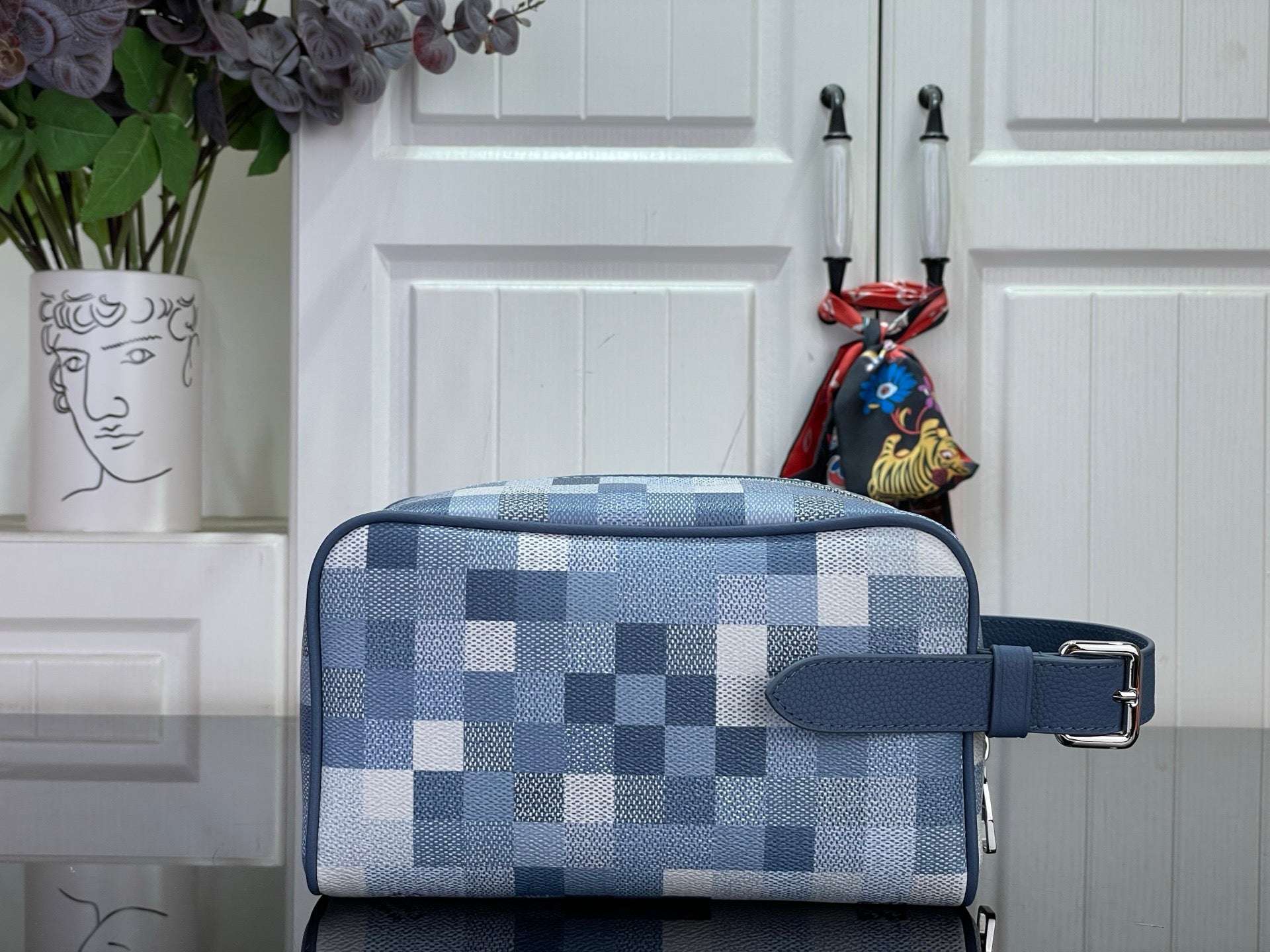 Blue check crossbody bag with front flap buckle strap