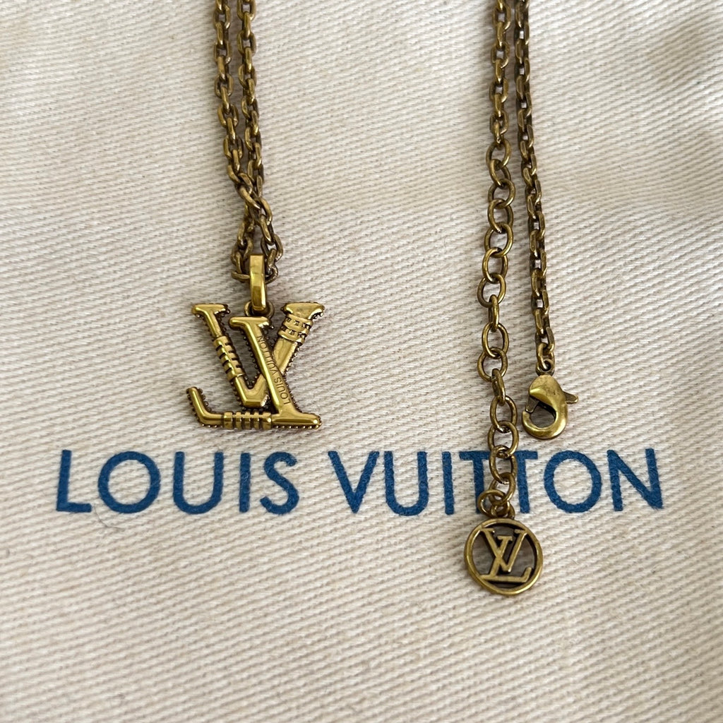 Gold-tone Louis Vuitton necklace with LV logo pendant and round charm