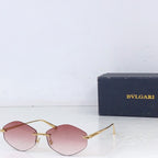 Gold-rim round sunglasses with pink lenses and slim metal arms