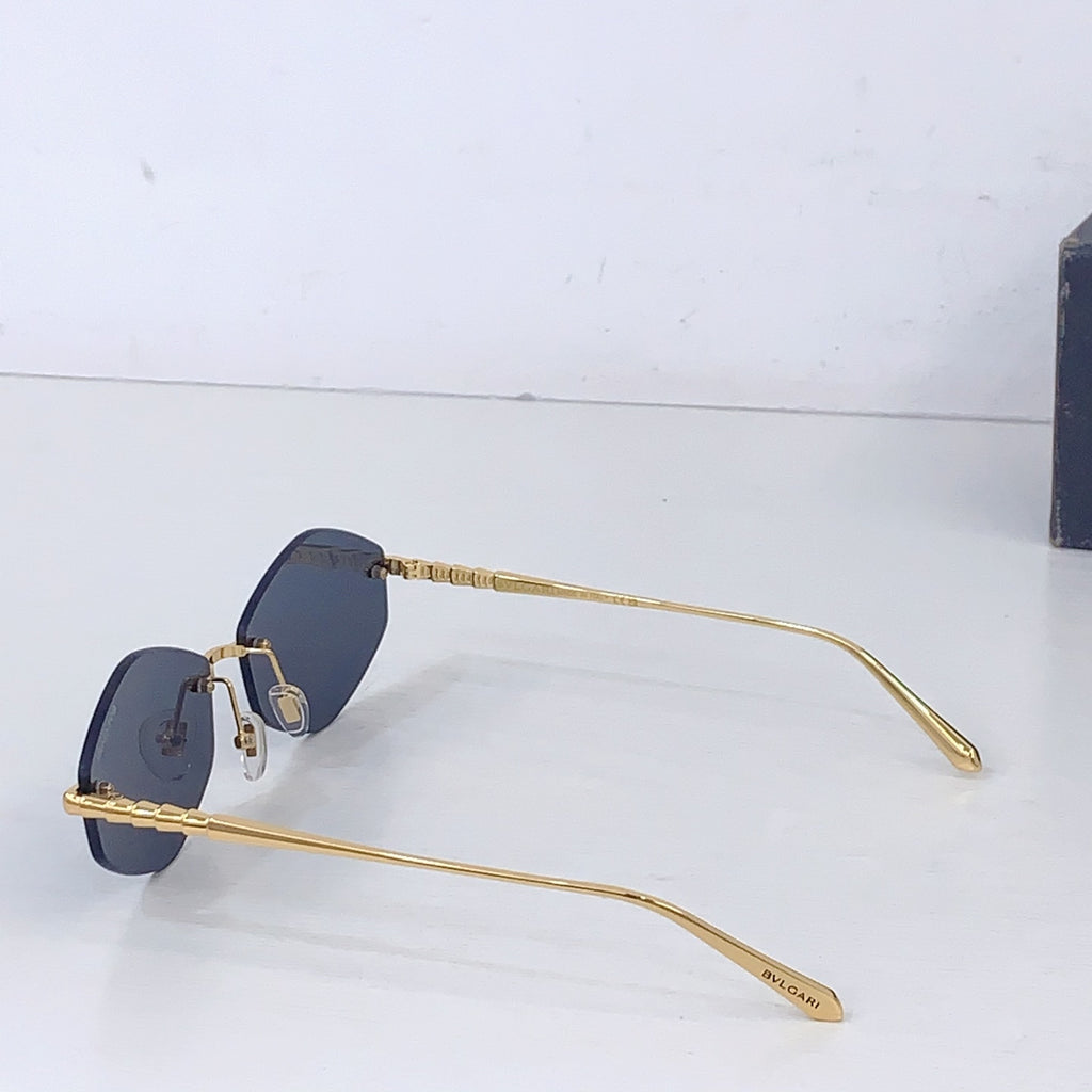 Gold sunglasses with dark blue round lenses and long metal temples