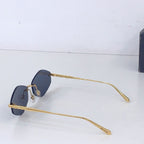 Gold sunglasses with dark blue round lenses and long metal temples
