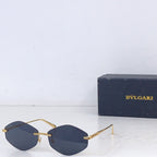 Gold-rim round sunglasses with dark blue lenses and metal side arms