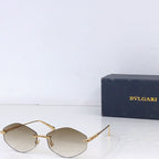 Gold-rim round sunglasses with light tan lenses and gold metal side arms