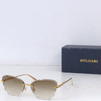 Bvlgari sunglasses with gold metal frame and light tinted lenses, front angle.
