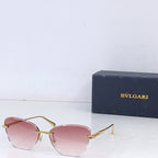 Bvlgari sunglasses with gold metal frame and pink tinted lenses, front angle.