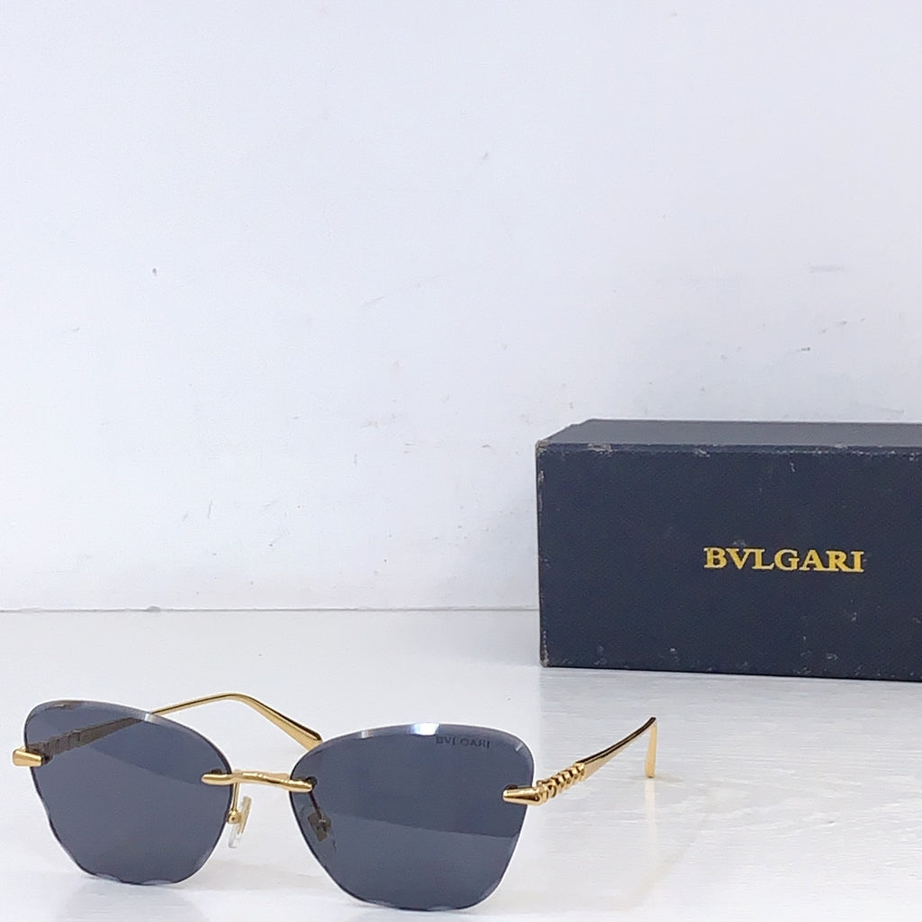 Bvlgari sunglasses with gold metal frame and dark gray lenses, front angle.