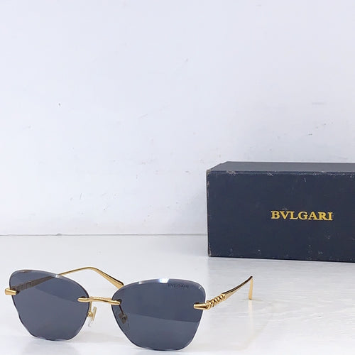 Bvlgari sunglasses with gold metal frame and dark gray lenses, front angle.