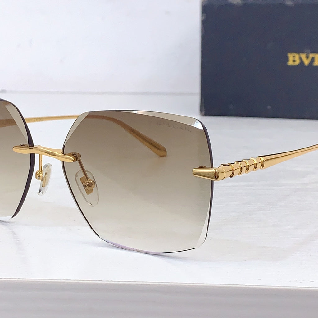 Bvlgari sunglasses close-up of gold temple chain and beige gradient lens