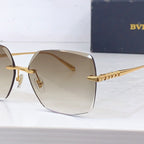 Bvlgari sunglasses close-up of gold temple chain and beige gradient lens