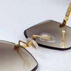 Bvlgari sunglasses close-up of gold nose bridge and beige gradient lenses