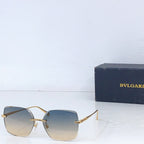 Bvlgari sunglasses with gold frame and gradient blue lenses, rectangular shield shape