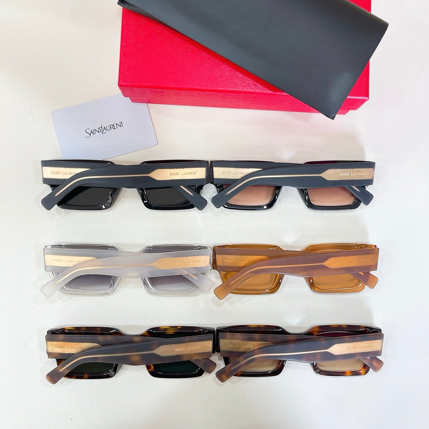 YSL glasses set: black, clear, and tortoiseshell square frames with tinted lenses