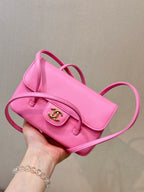 Chanel pink mini bag with flap, front CC logo, and long crossbody strap