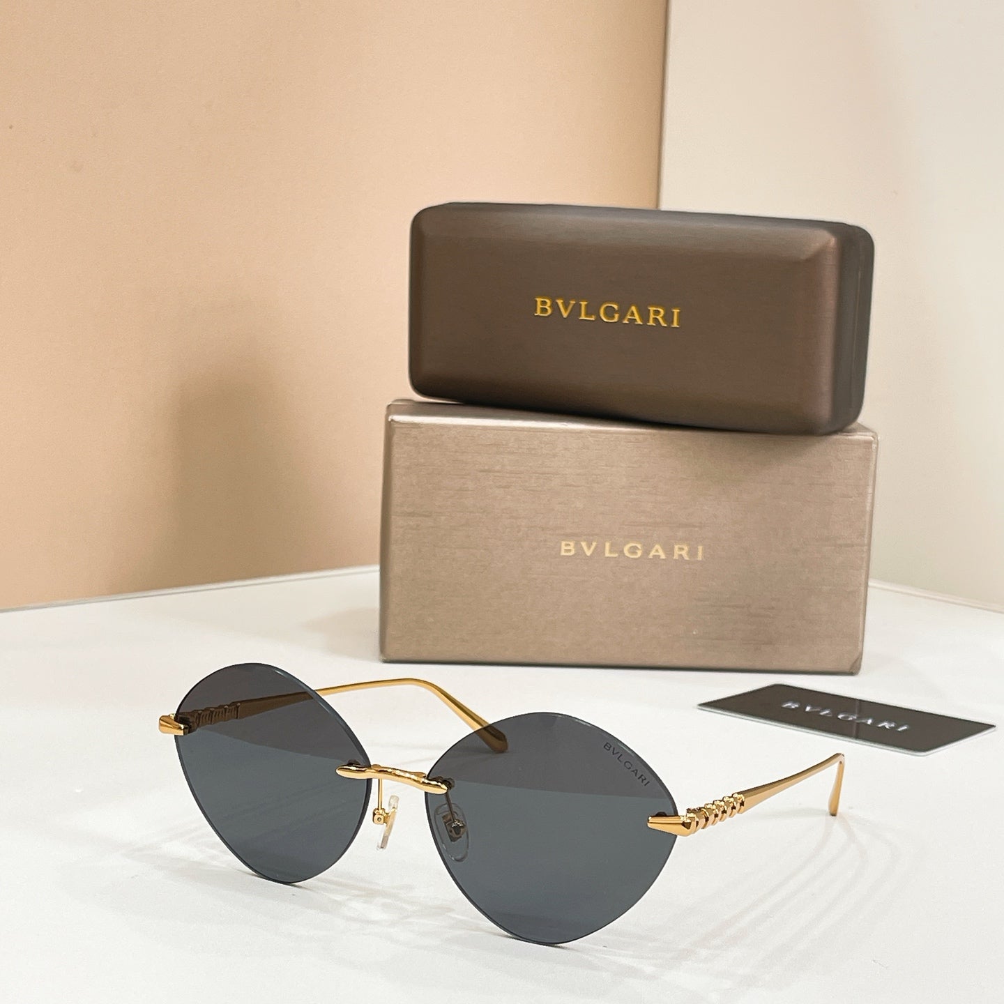 Sunglasses with gold-tone frame and dark round tinted lenses