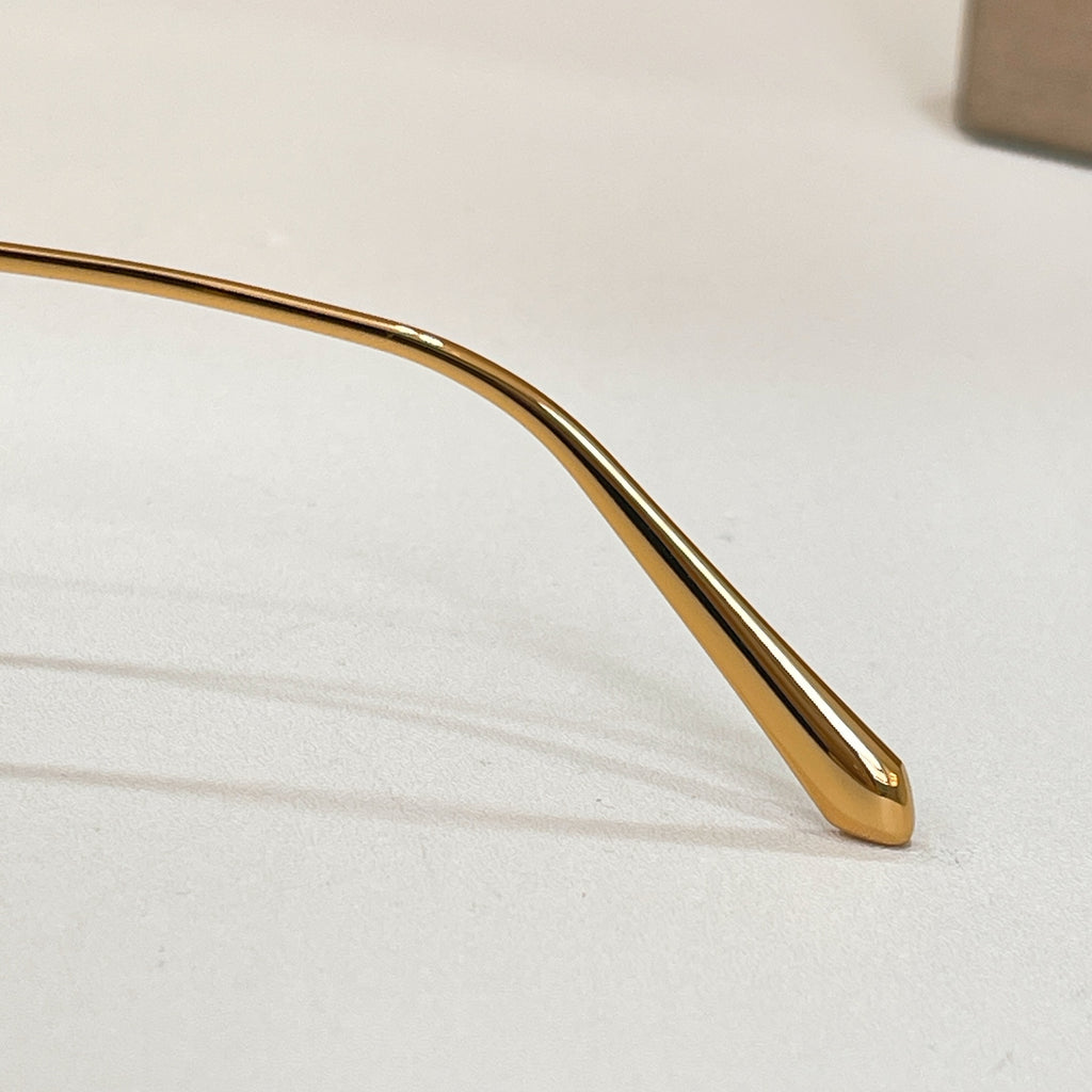 Gold-tone sunglasses temple arm detail