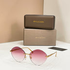 Sunglasses with gold-tone frame and pink round tinted lenses