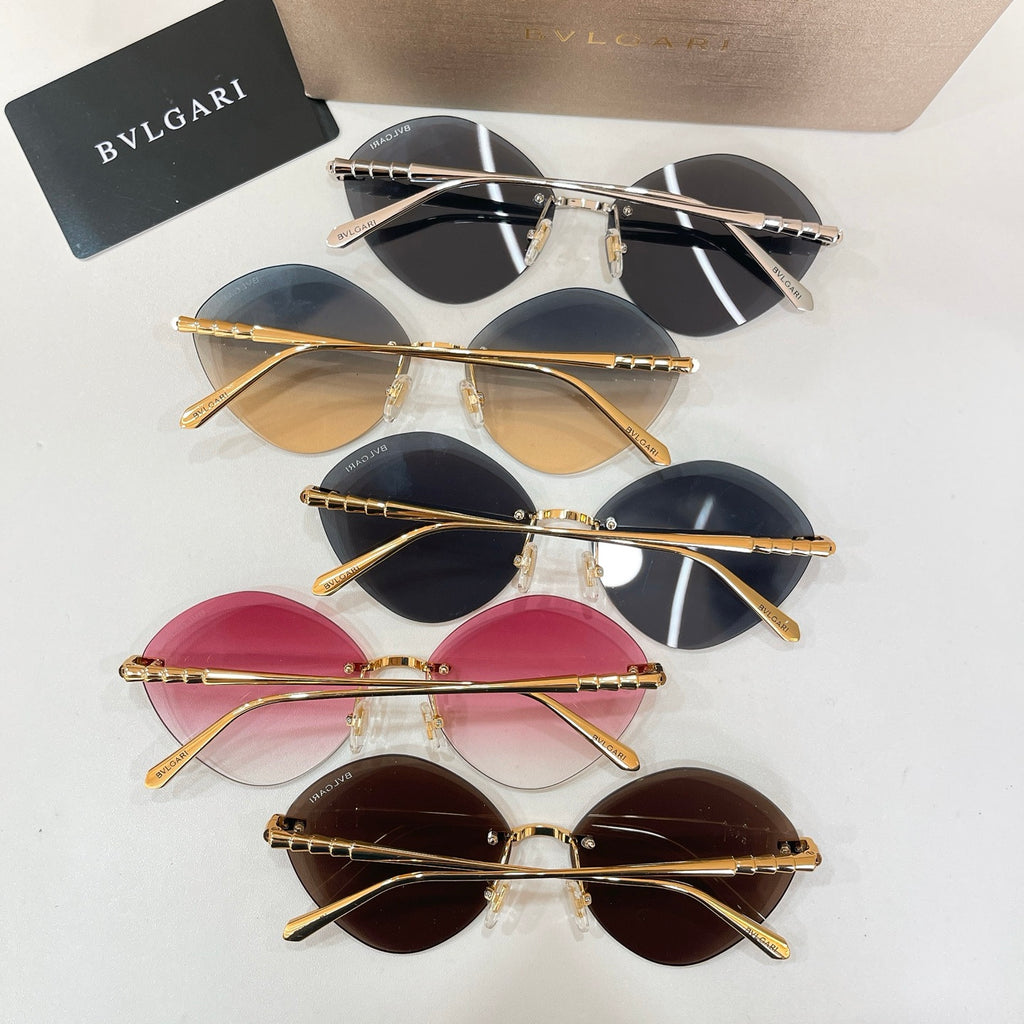 Assorted sunglasses with gold-tone frames and tinted round lenses