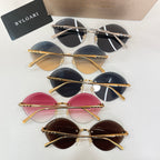 Assorted sunglasses with gold-tone frames and tinted round lenses