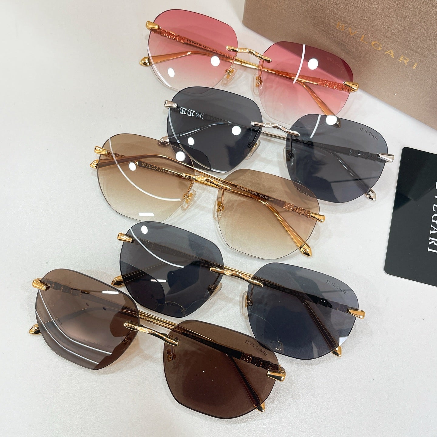 Set of Bvlgari sunglasses with mixed tinted lenses and gold-tone frames