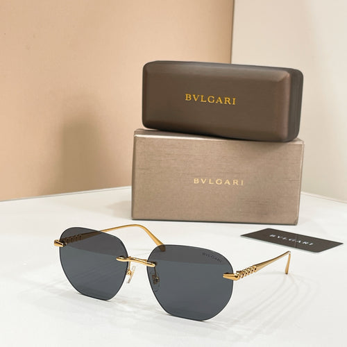 Round Bvlgari sunglasses with dark lenses and gold-tone frames