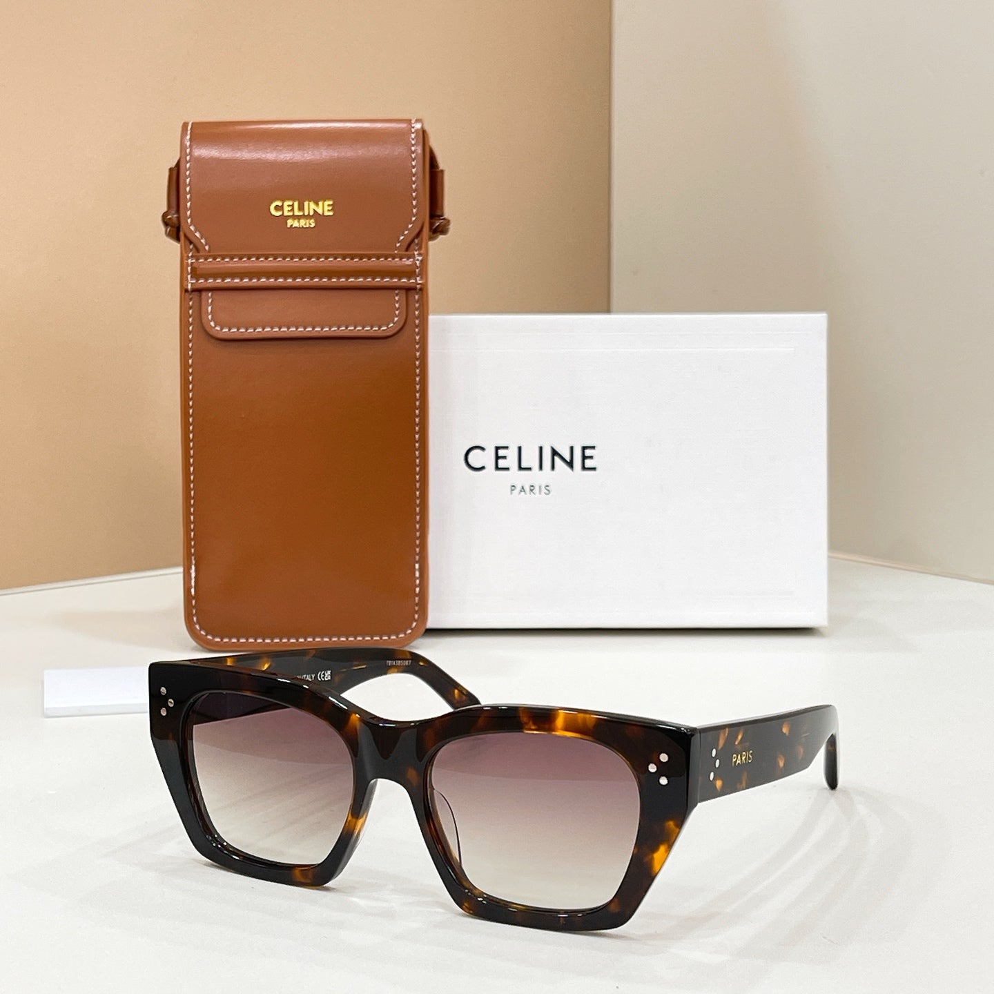 Celine sunglasses with tortoiseshell frames and mauve-tinted lenses