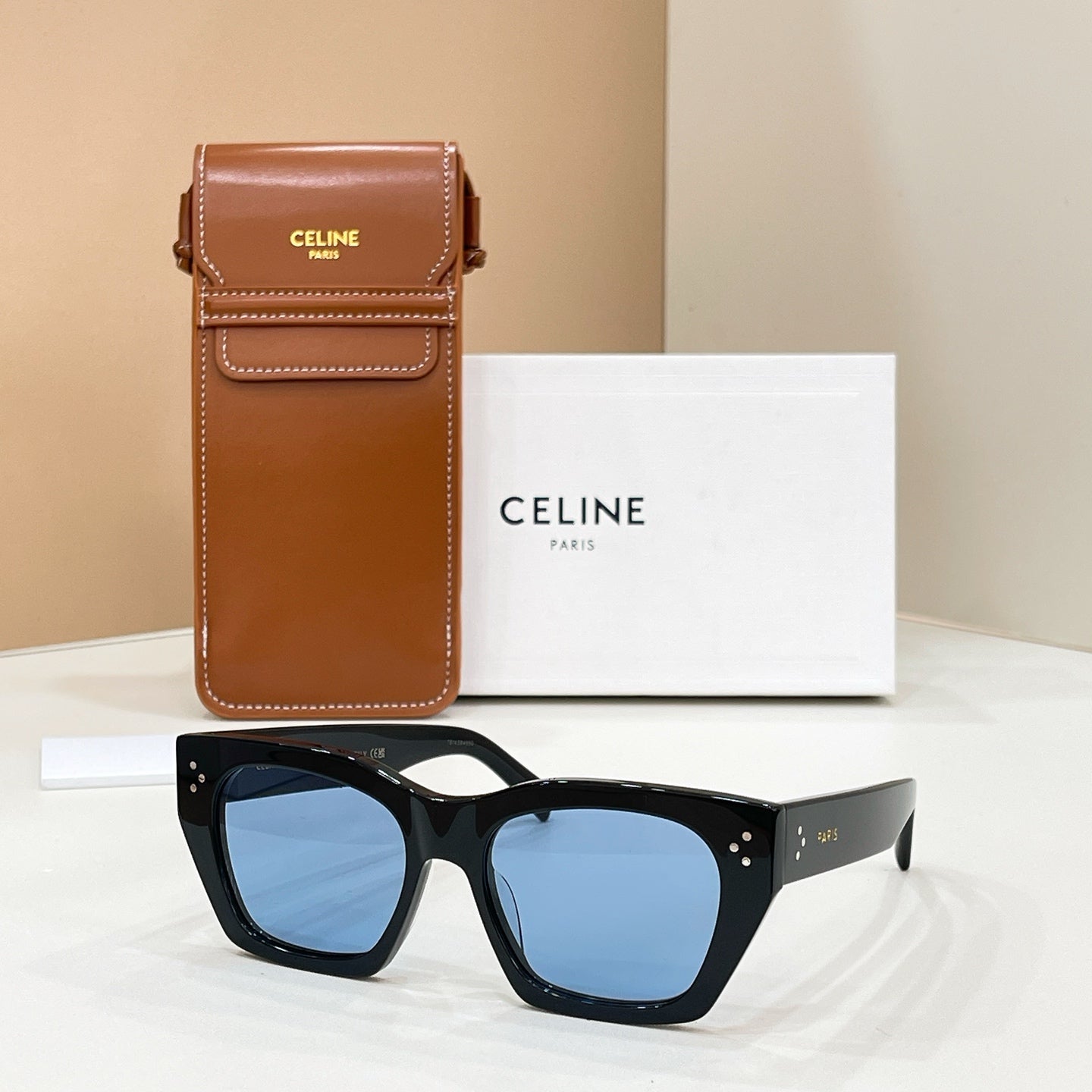 Celine sunglasses with square black frames and blue tinted lenses