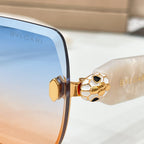 Bvlgari sunglasses hinge with gold emblem on a tortoise temple